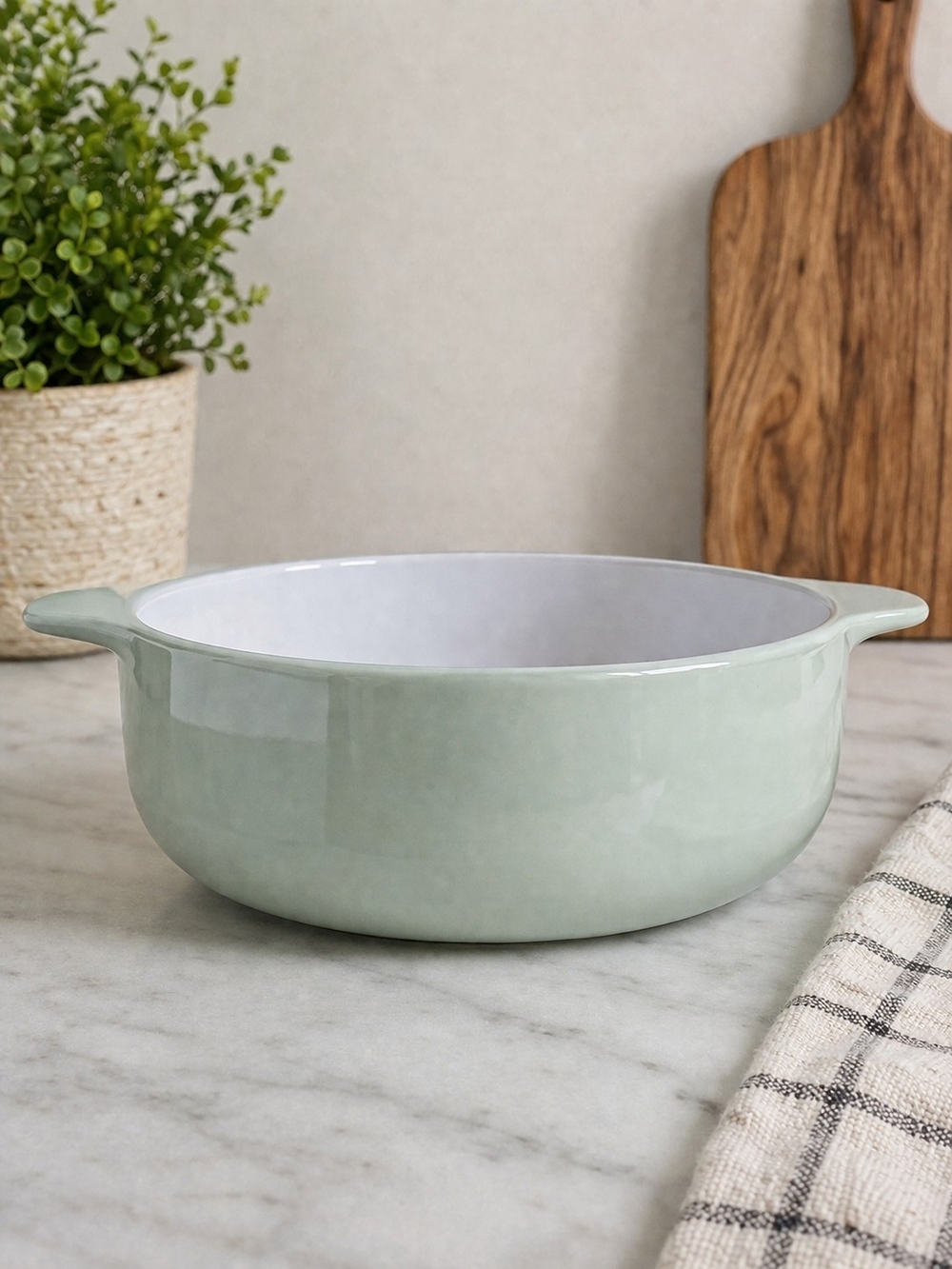 KitchenAid 2.25 Quart Round Casserole Baker in a soft mint green finish.